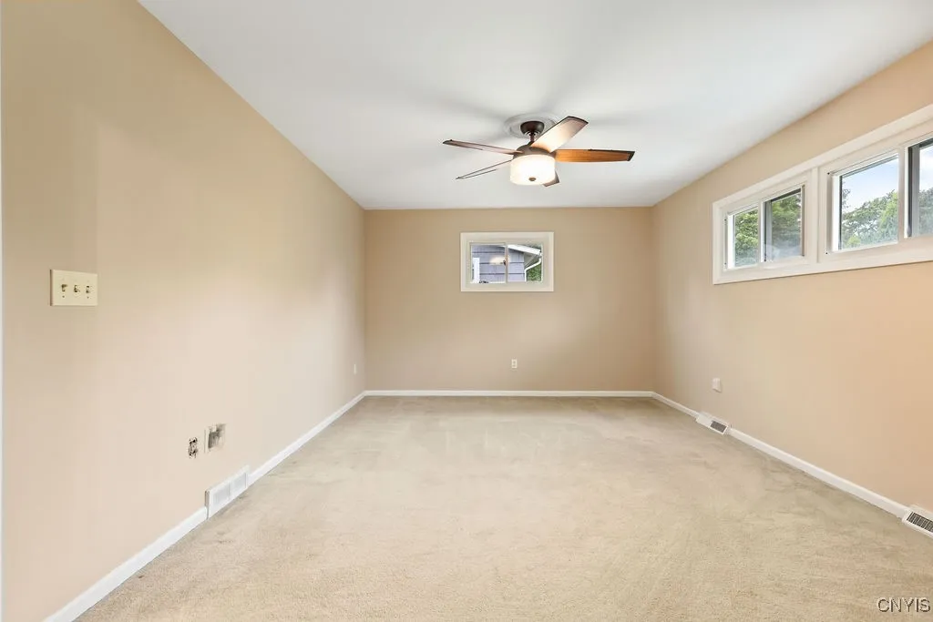 The main bedroom is large enough for a king-sized bed and several more pieces of furniture. It is located at the back left corner on the third level of the house.