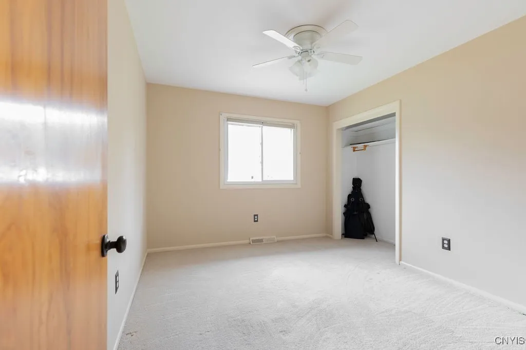 This bedroom is located in the middle, front position on the second story of the home.  It has fresh paint and new carpeting.