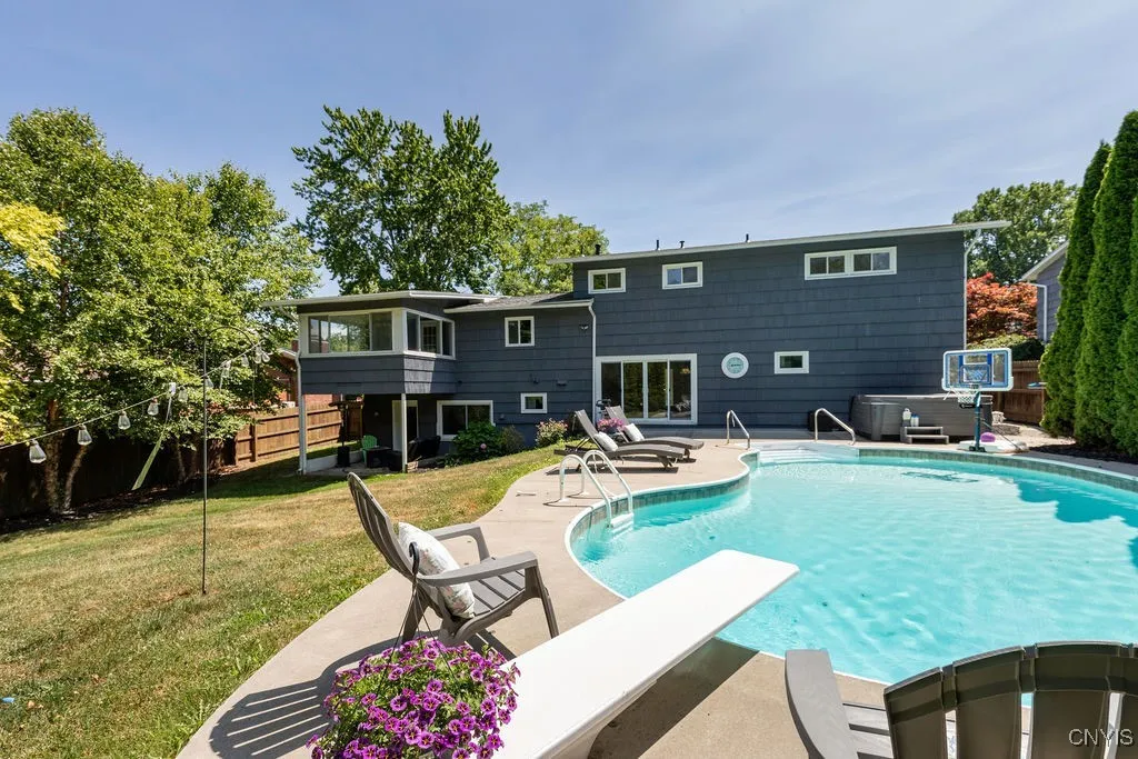 Relax by the pool or in the hot tub, or grill outside, there is plenty to do in this lovely back yard.  This is a fully fenced back yard.