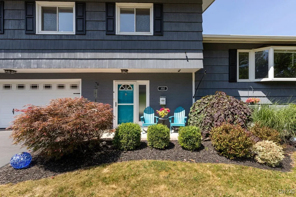The sharp turquoise main door leads to...