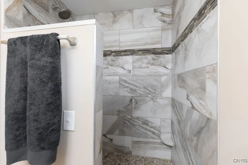This step in shower is part of the private bathroom for the main bedroom.