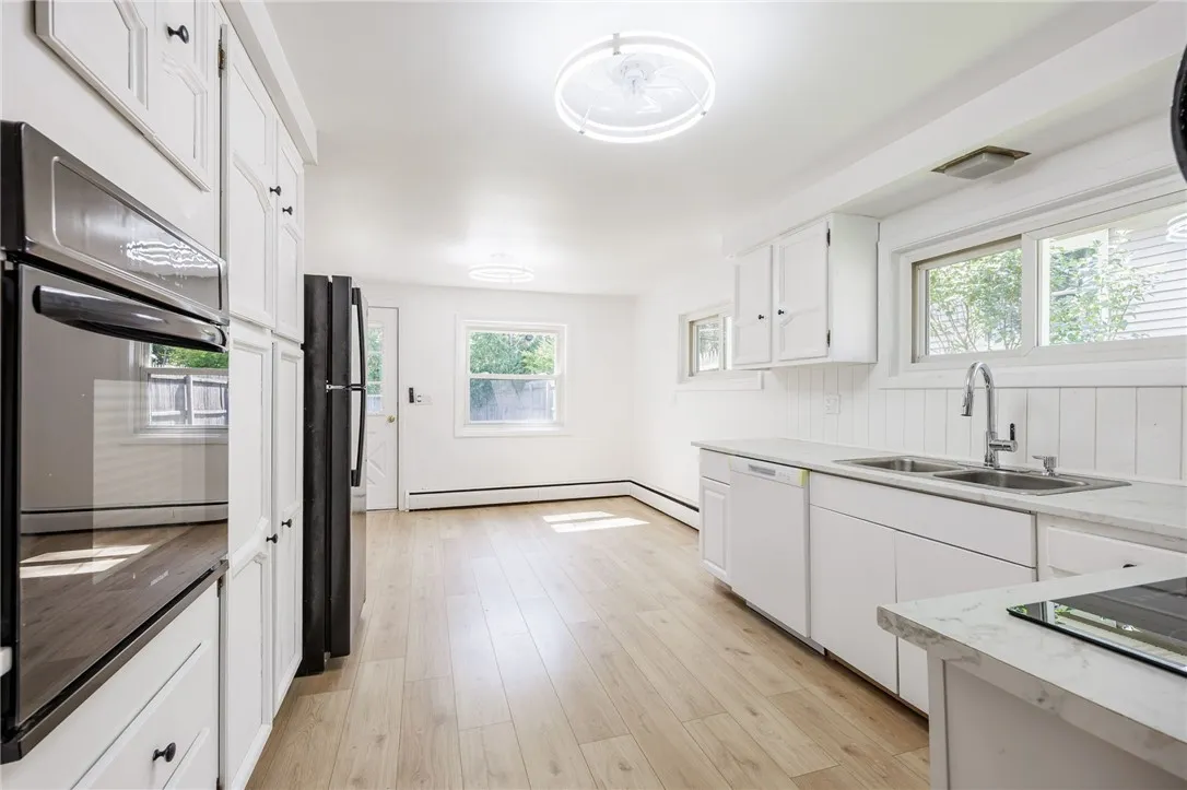 eat in kitchen that leads to the backyard