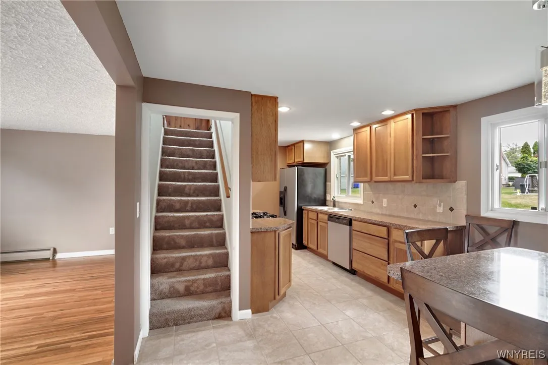Stairway Off Kitchen Leading Up To 2nd Floor