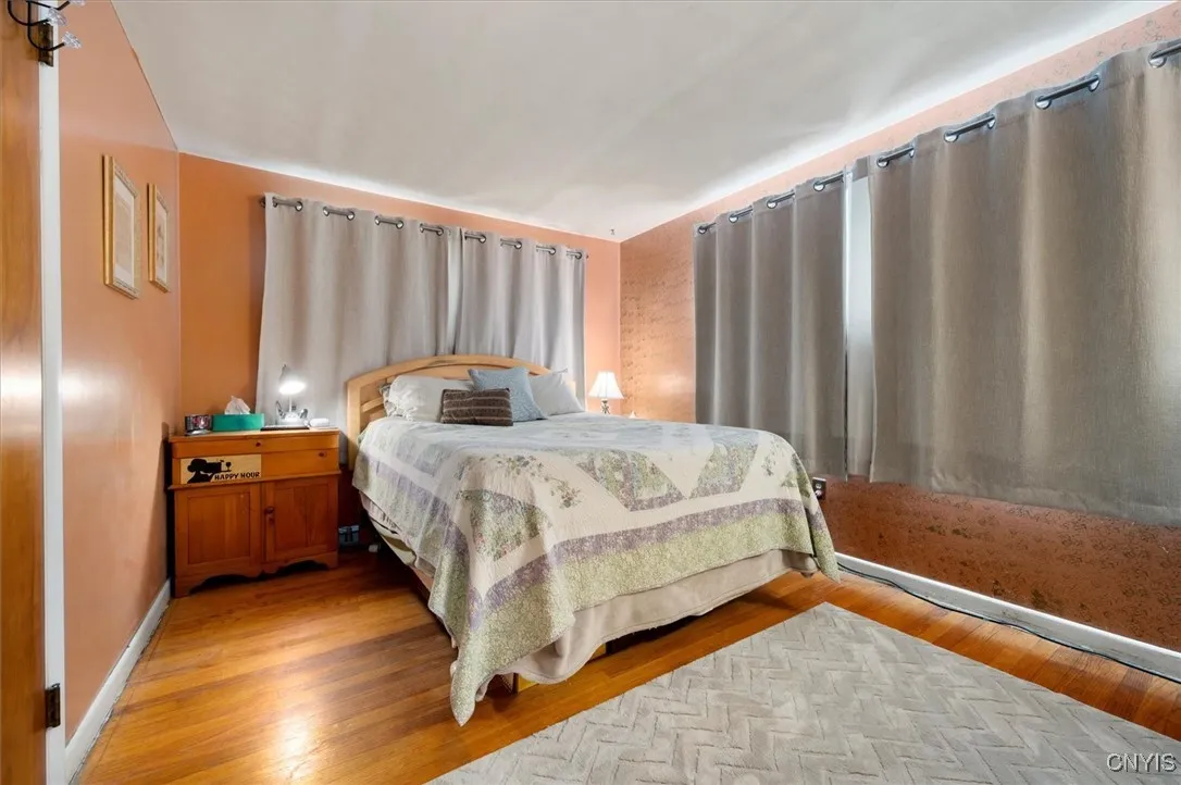 Primary bedroom. Wall on the right has been sponge painted as an accent wall.