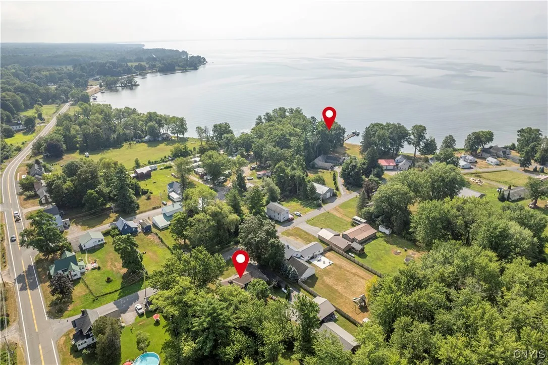 AERIAL VIEW WITH ARROWS MARKING HOUSE & WATERFRONT