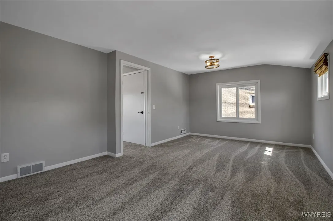 Huge master bedrm. newly carpeted, opposite view