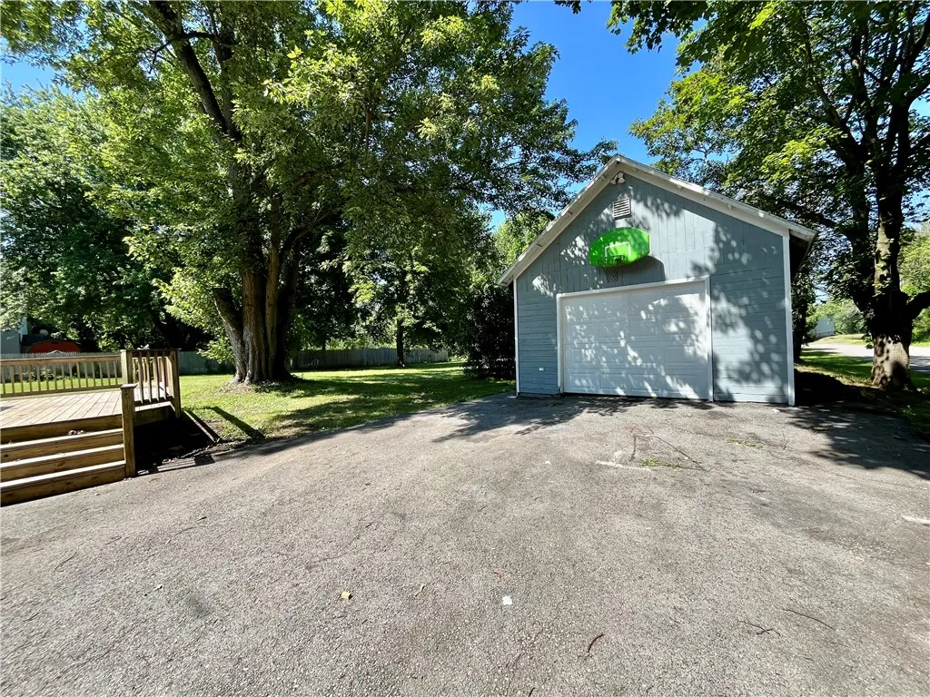Detached garage & paved driveway