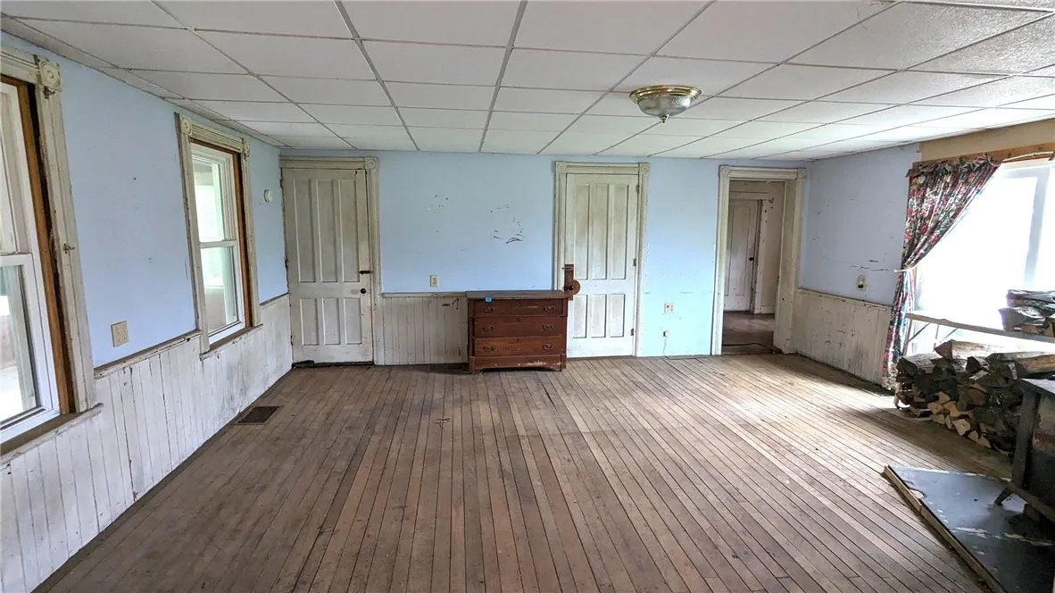 spacious room adjacent to kitchen. Original wood work an floors