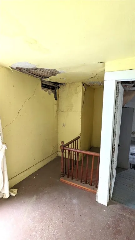 Rear upper landing with 2nd staircase that has been closed off. Can certainly be opened up again..