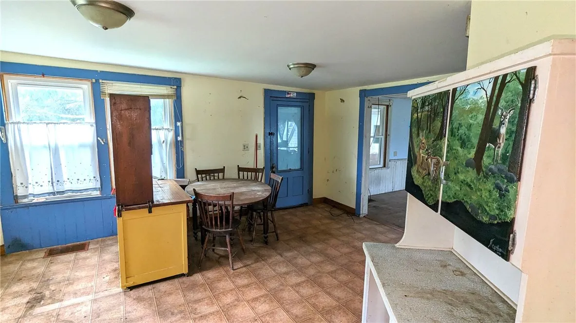 dining area of kitchen and entrance to enclosed front porch