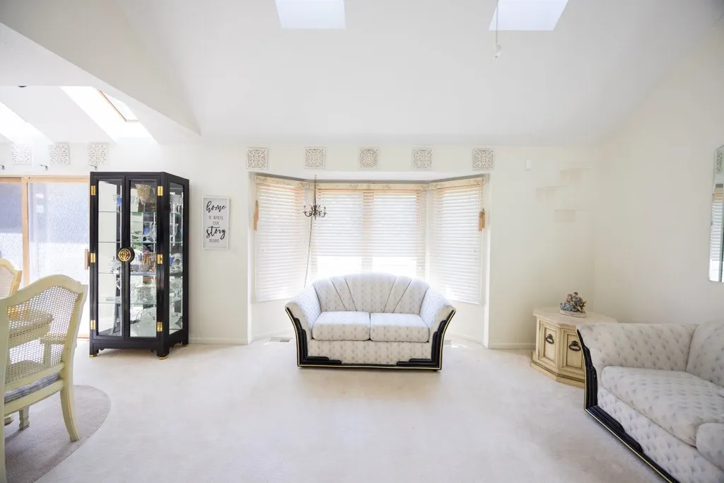 GREAT ROOM WITH GAS FIREPLACE CATHEDRAL CEILINGS & SKY LIGHTS