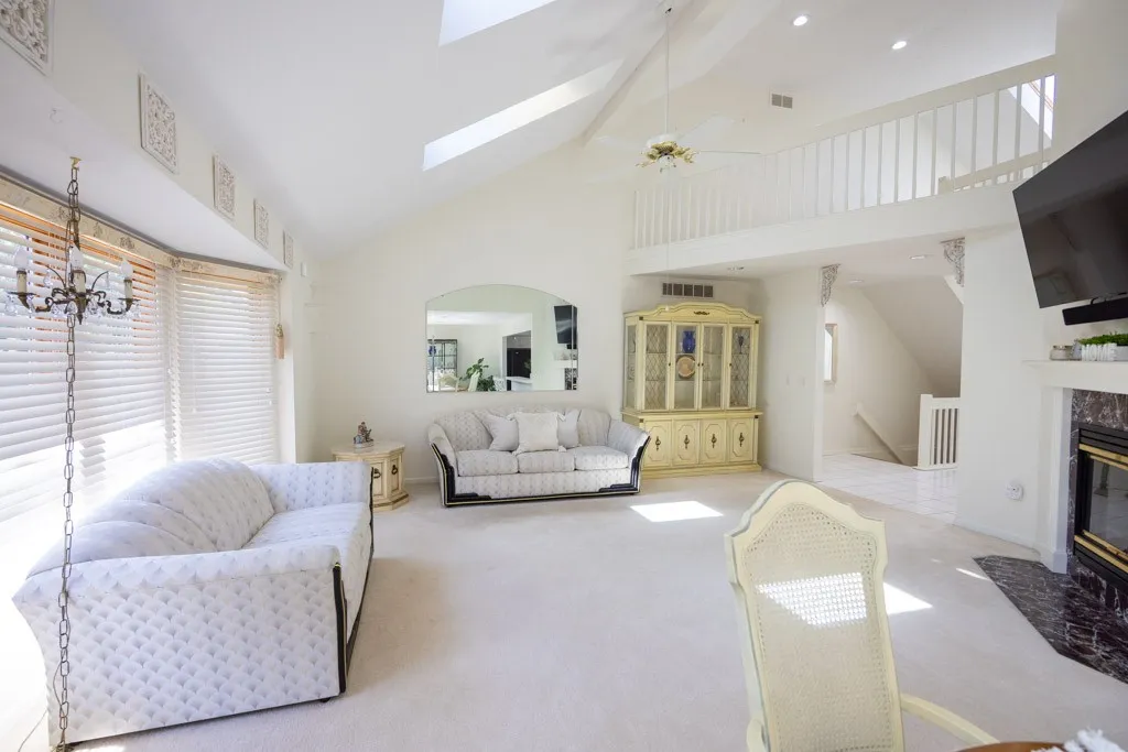 GREAT ROOM WITH GAS FIREPLACE CATHEDRAL CEILINGS & SKY LIGHTS
