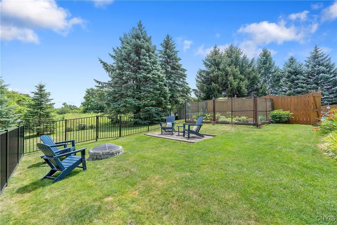 Fenced in firepit and enclosed garden area