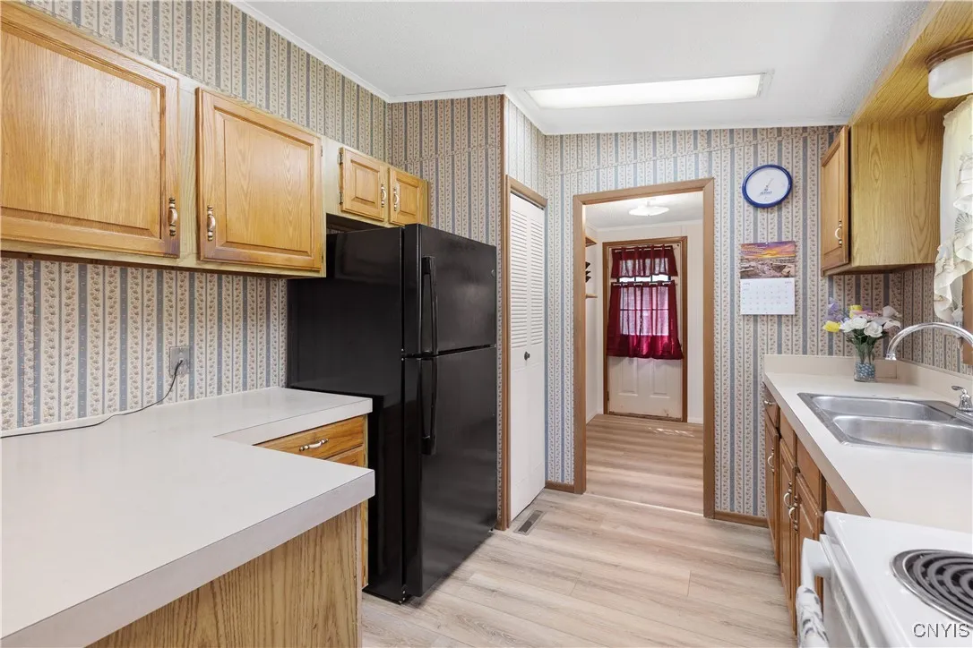 Kitchen looking into the laundry room