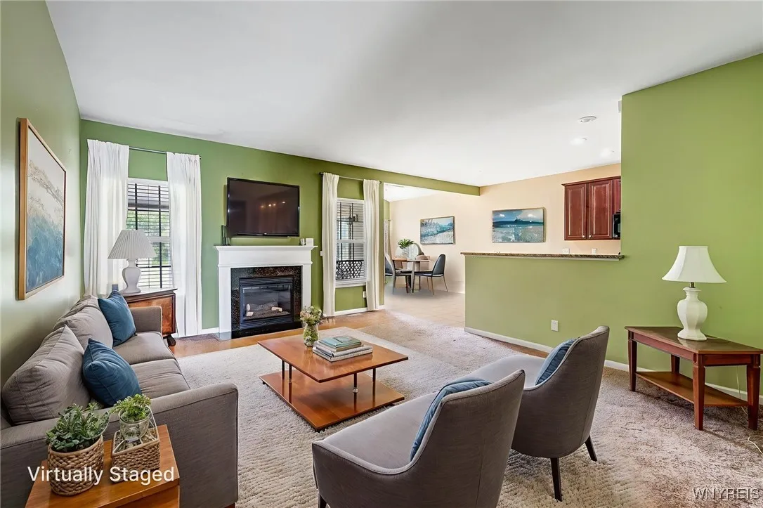 Living room is a good size and offers conversation into the kitchen. Great for parties.