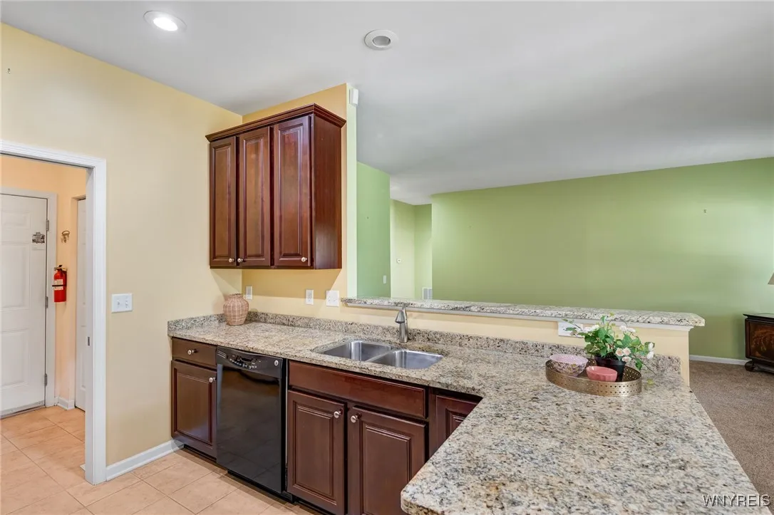 Granite countertops, under mount sink. You can engage in conversation with family and friends as you prepare a meal or snacks.