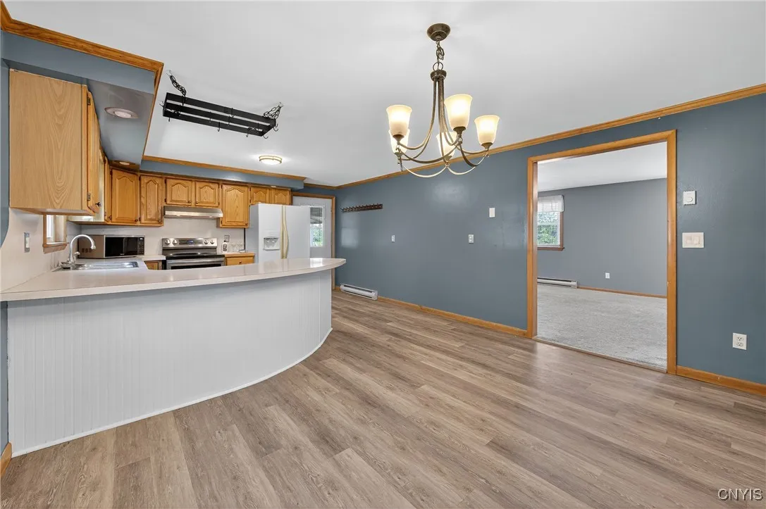 View of the kitchen from the dining room.  Perfectly looks into the kitchen and living room, making the home feel open and spacious.