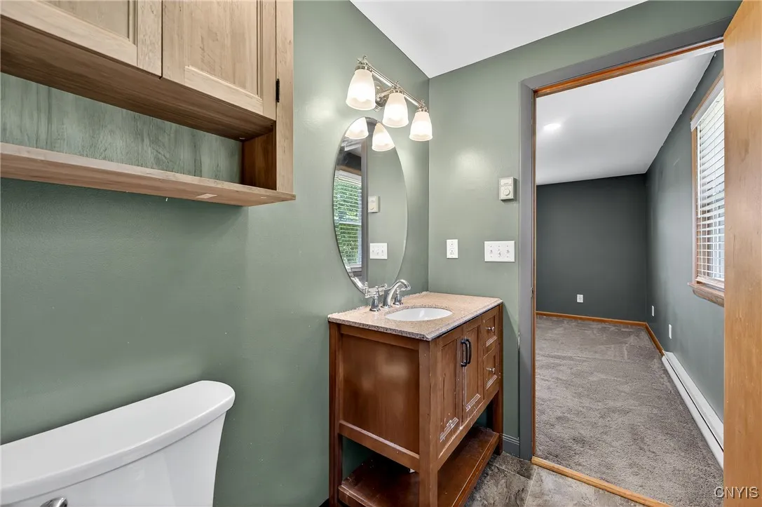 View of the full bath in primary bedroom.