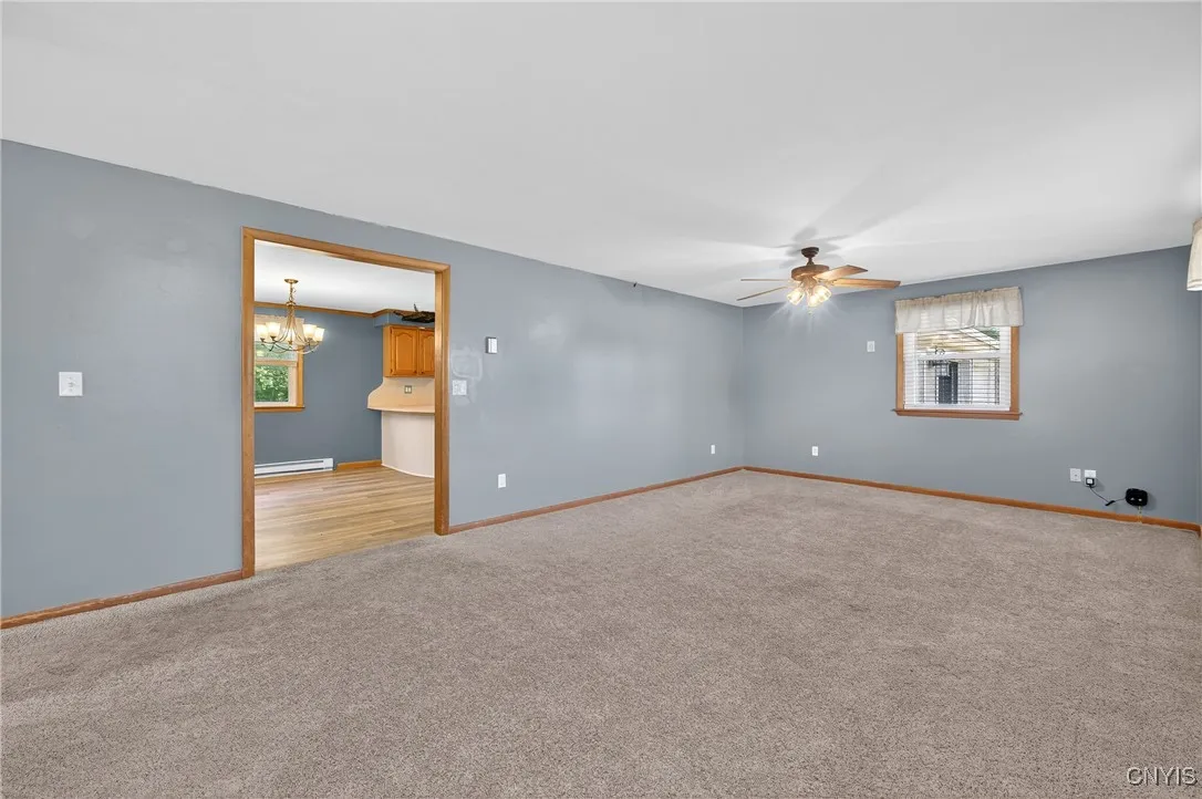 There is an abundance of space in the living room!  Easily accomodate a sofa, loveseat, chairs, entertainment center and more!