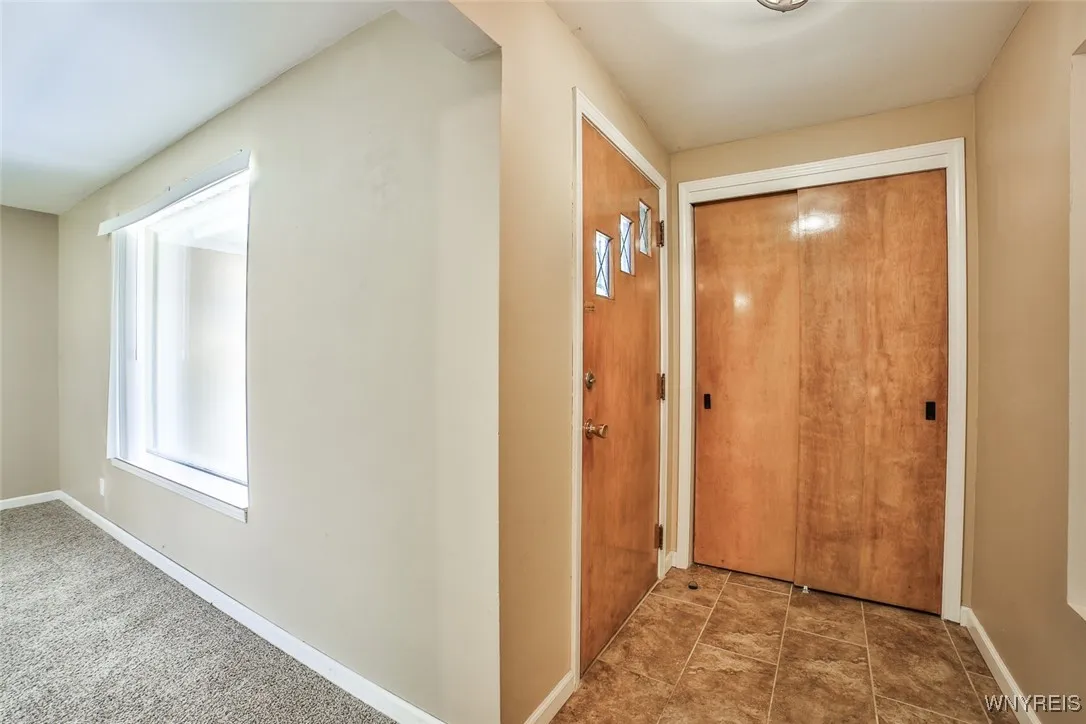 Front door / foyer area with a nice-sized coat closet.