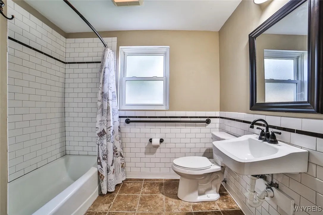 Toilet grab bars are in both bathrooms