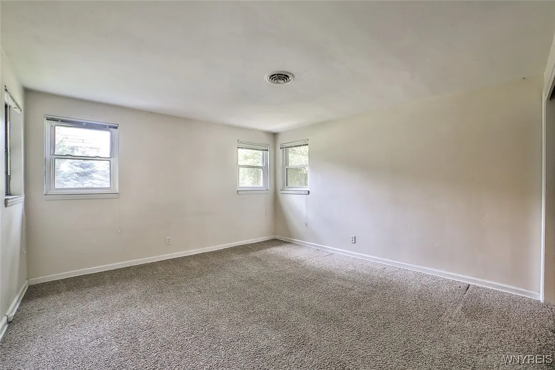 There are windows on three walls in the primary BR