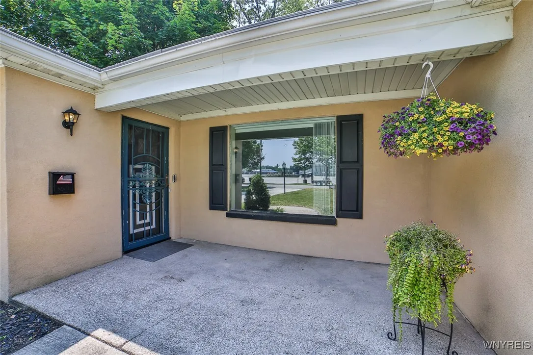 Covered front porch is perfect for morning coffee - it faces East!