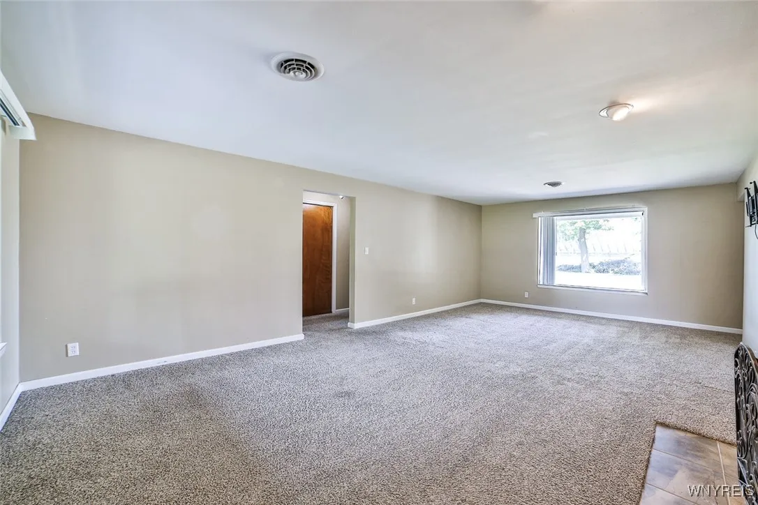 Plenty of light from the front window!  The hallway is to the bedrooms and full bath.