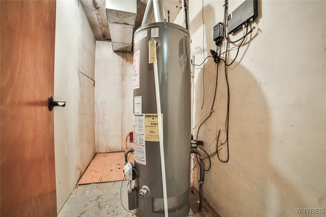 Hot water heater is in closet in foyer, and the furnace / AC is in the attic.