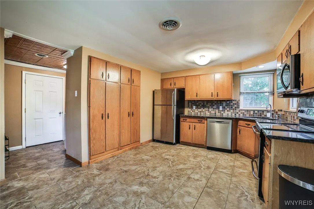 On the left is the garage entrance, and the laundry and 1/2 bath are over there too