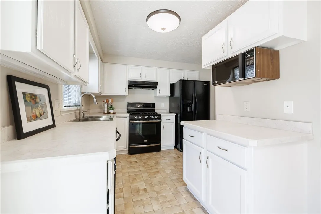 Bright Kitchen that features an abundance of cabinet & counter space for all of your culinary needs