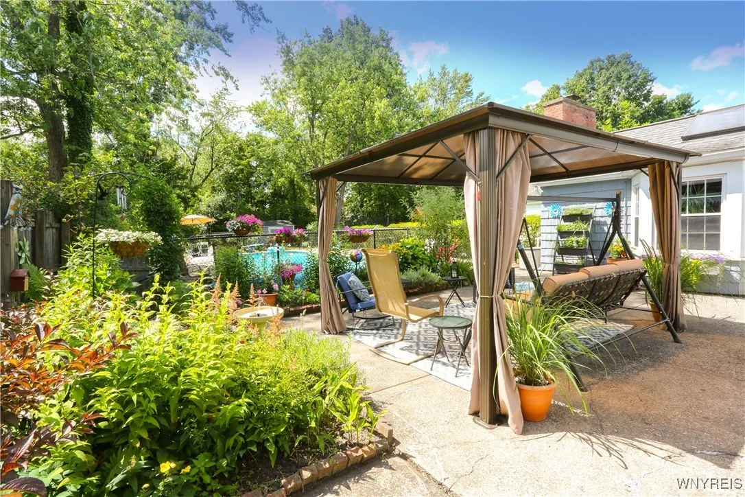 You will love to spend time all summer in this beautiful garden area with a great inground pool.