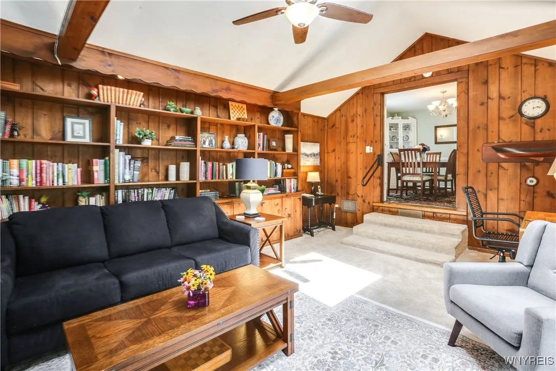 Family room has plenty of space for desk area and built in bookcases are wonderful with storage underneath. ( there are parquet wood floors under the carpet).