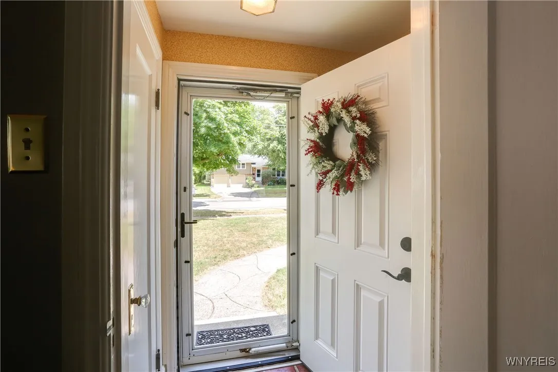 Entrance Foyer w coat closet. Newer exterior/ screen doors.