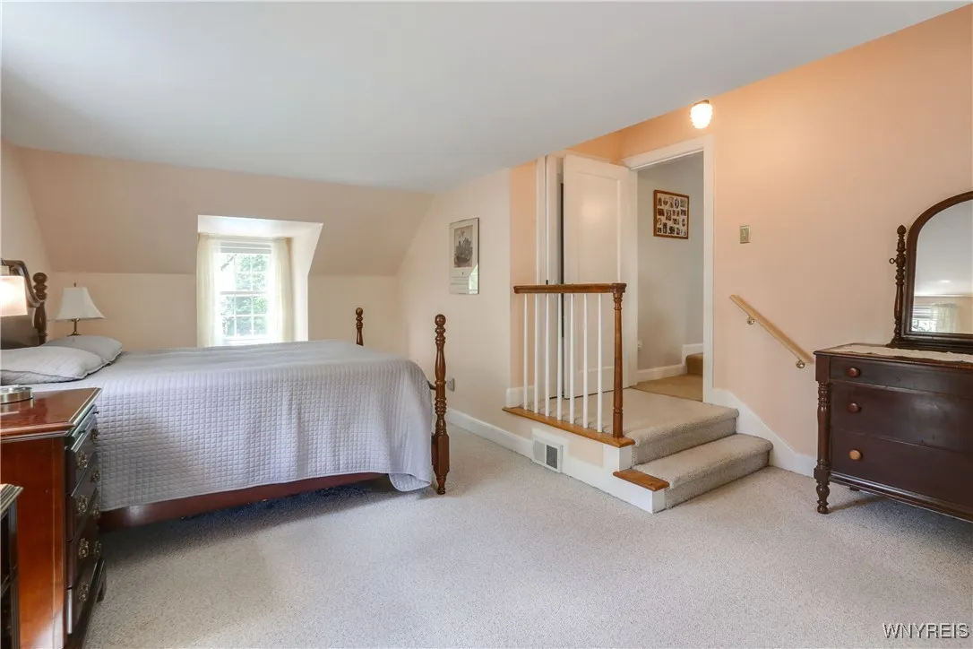 Primary Bedroom with lg closet.  No popcorn ceilings which is a plus. Windows facing east, west and south.