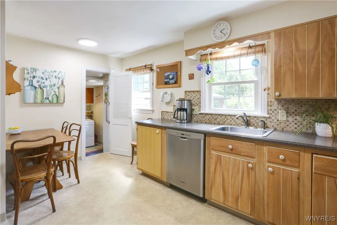 There is a cute half bath off the kitchen as well as 1st floor laundry near the back door.  Washer & Dryer will stay if needed.