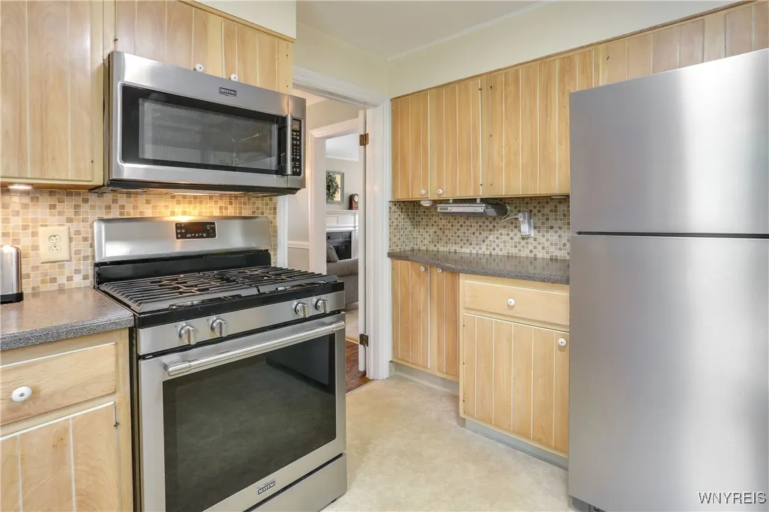 Gas SS stove full grid top and SS microwave is newer and will stay.  Frig will stay as well.