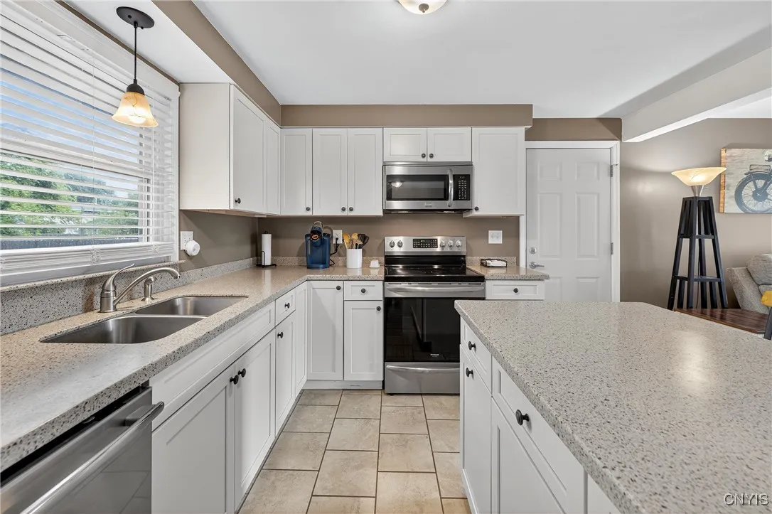 Newer Kitchen featuring solid surface countertops and new appliance's.
