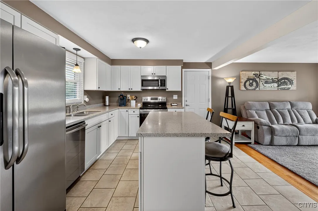 Beautiful tile floor and SS appliances