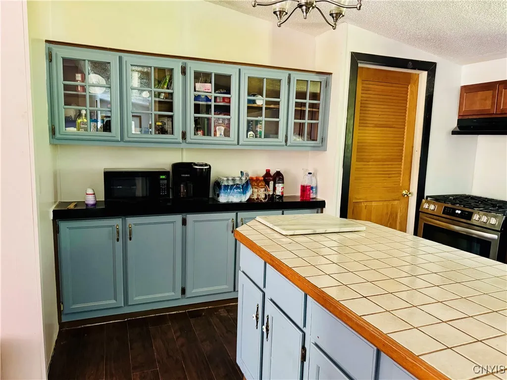 Additional Cabinetry with Glass Front Cupboards.