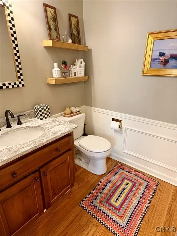 Half bath near laundry room and garage entrance.