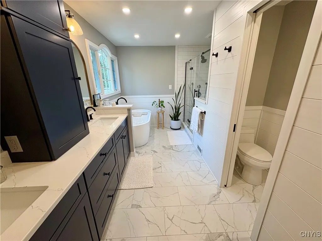 Luxurious bath with separate commode.