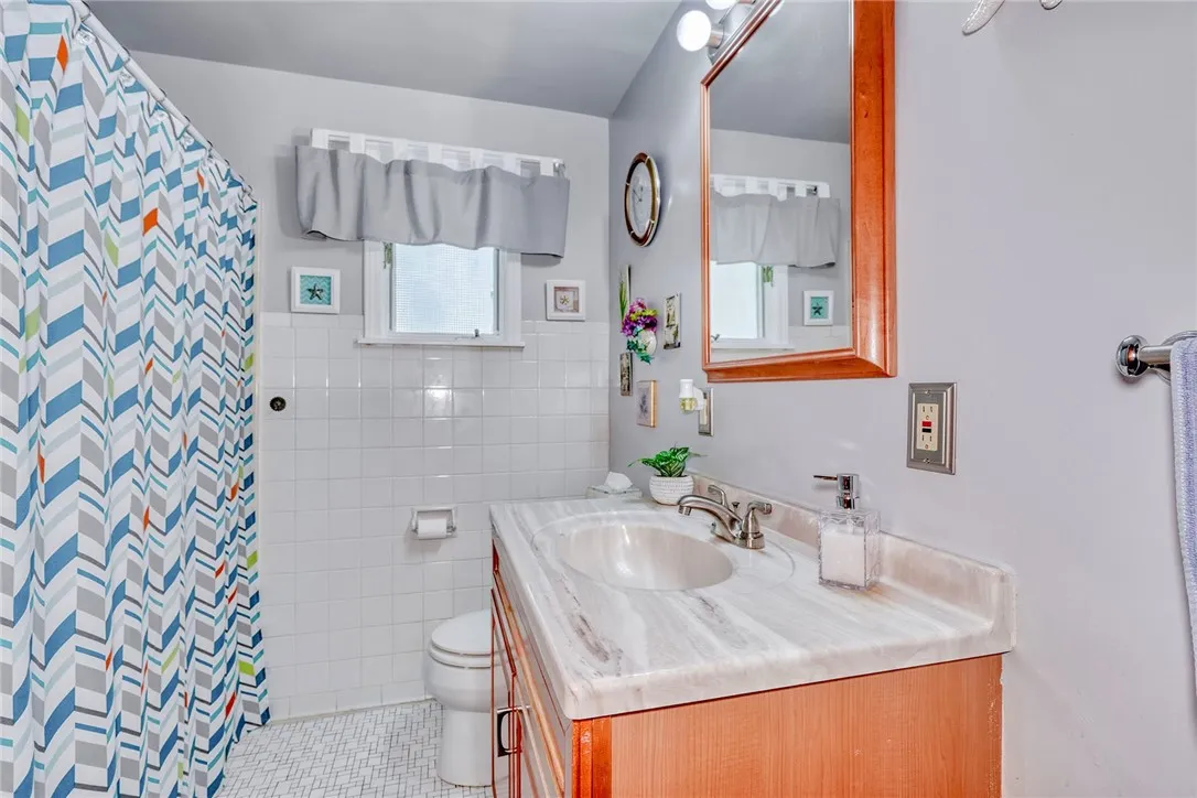 FIRST FLOOR BATH WITH TILED WALLS AND FLOOR
