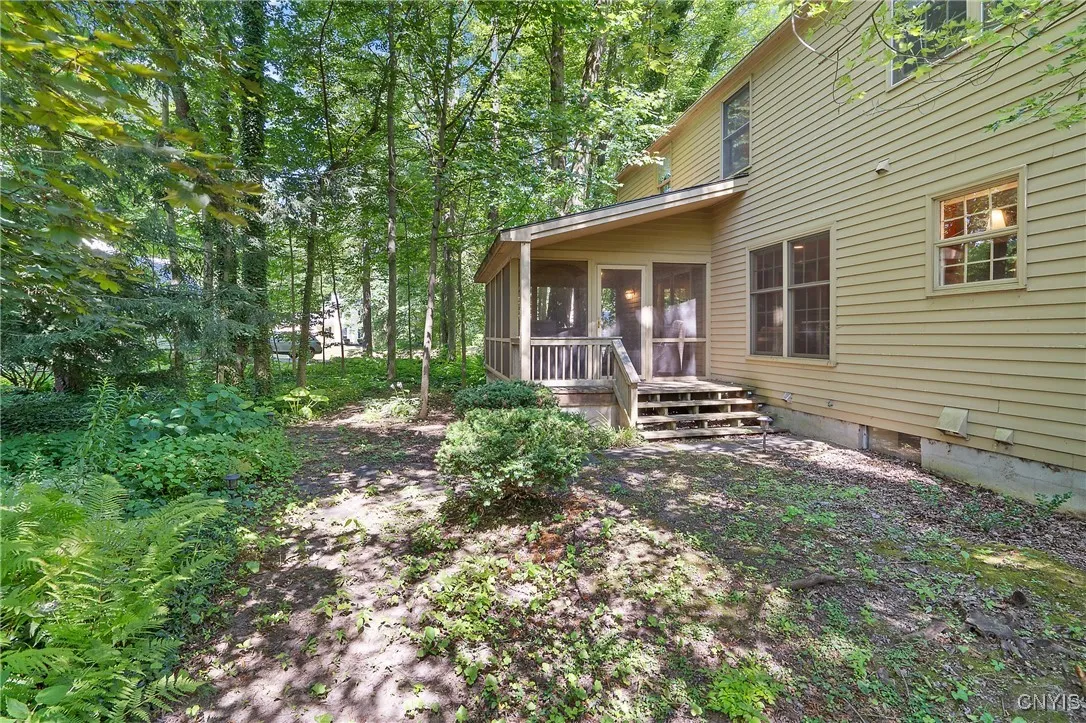 BACK ENTRANCE TO SCREENED IN PORCH