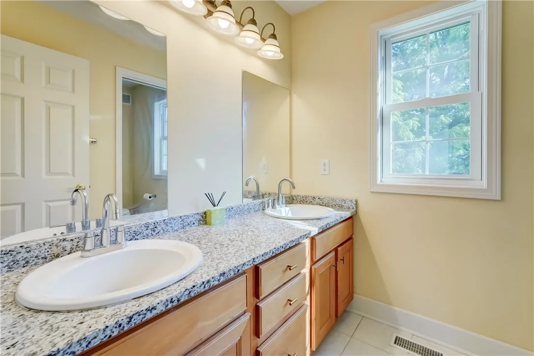 2nd floor full bathroom with double sinks and tub/shower combo