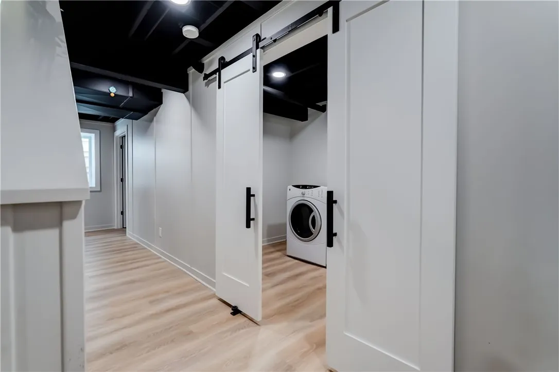 Barn doors allow you to hide the laundry room clutter or turn it into another bathroom