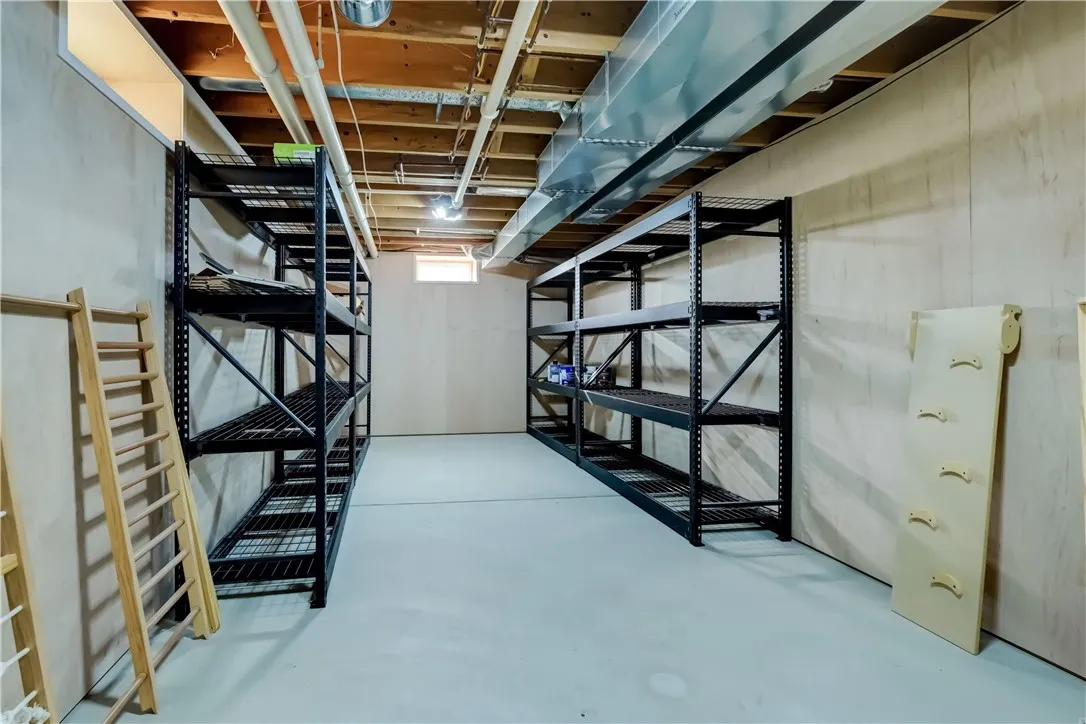 Wood walls with heavy duty shelving...Great workshop, exercise or crafting room ...you decide
