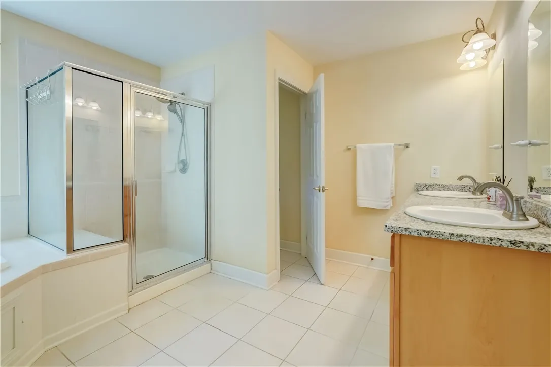Primary bathroom with whirlpool tub and separate shower