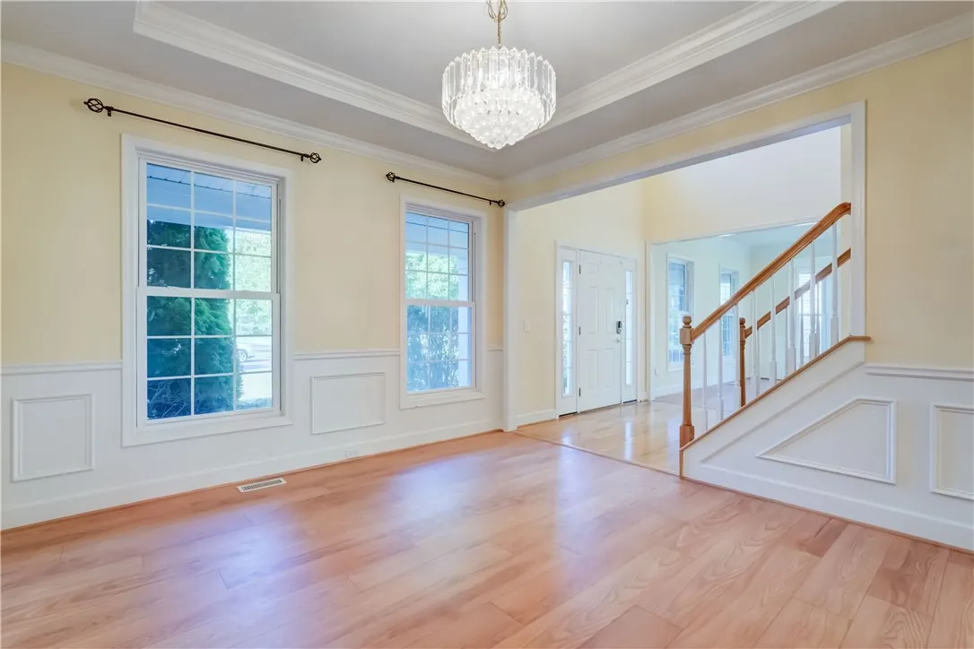 Formal dining room overlooks landscaped front yard