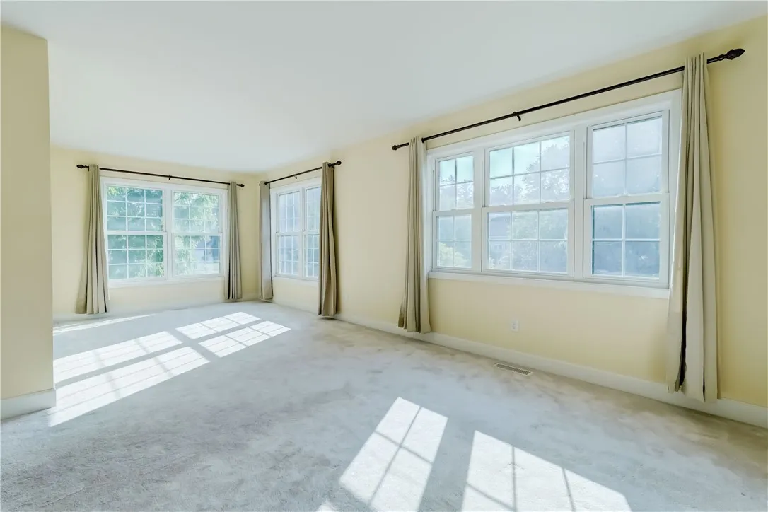 Huge L-shaped primary bedroom